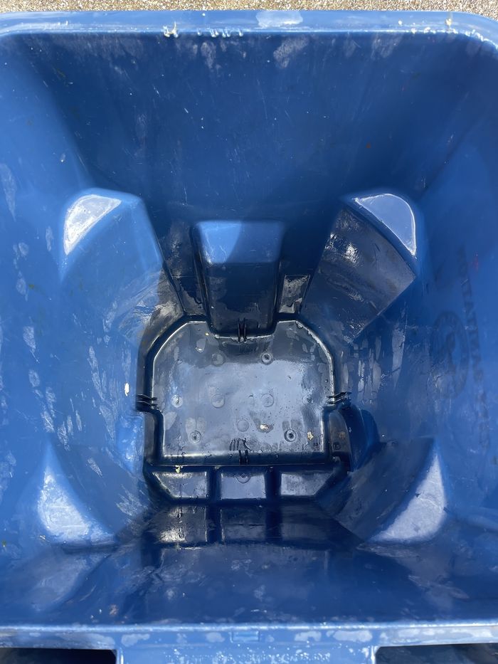 The inside of a wheelie bin after hot-water cleaning
