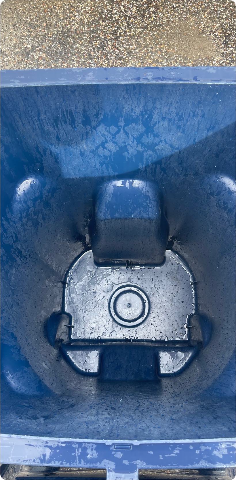 The same wheelie bin interior after hot-water cleaning