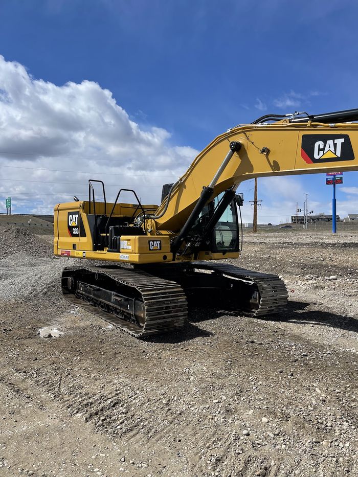 A tracked excavator cleaned on site