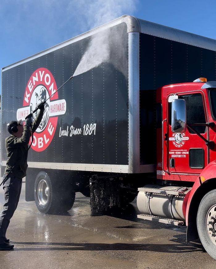 A box truck being washed down on site