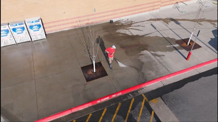 A commercial floor being washed down