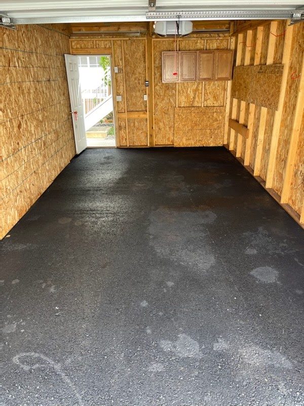 A garage floor after hot-water cleaning