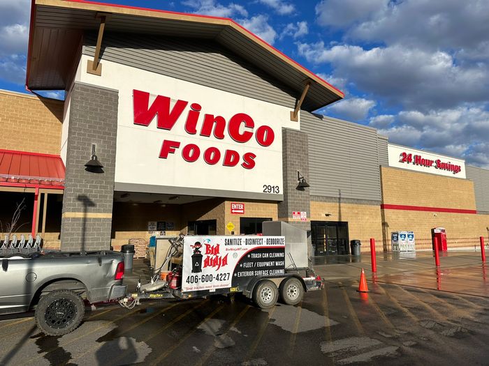 The Bin Ninja truck and trailer on a grocery store forecourt