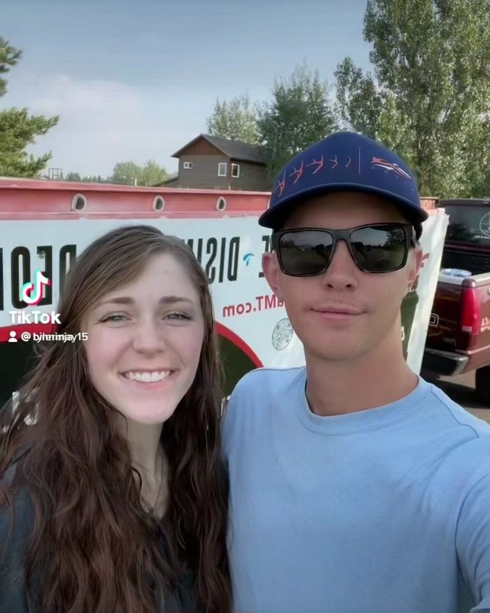 Two members of the Bin Ninja team in front of the truck